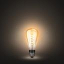 Philips Hue White E27 Filament Giant Edison - weiss leuchtend vor schwarzem Hintergrund